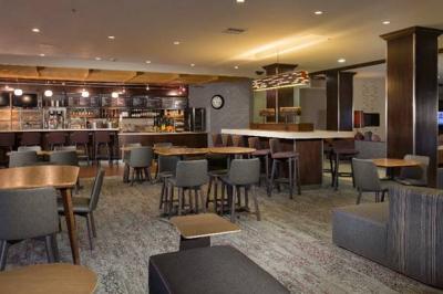 Arbor Lodging Partners Acquires Courtyard in Des Moines, IA Courtyard West Des Moines Jordan Creek Bistro Seating Area